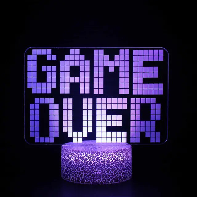 a lit up game over sign sitting on top of a table
